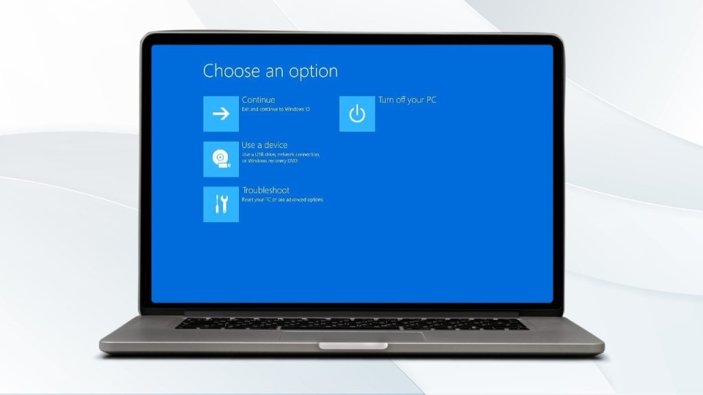 A laptop screen showing a blue background of Safe Mode in Windows 10/11 with a white "Choose an option" prompt. Below that, there are three options: "Continue," "Use a device," and "Troubleshoot," each with an icon.