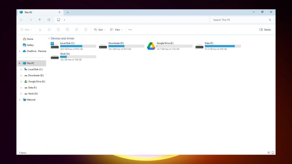 A screenshot of a Windows File Explorer window. The window shows the "This PC" folder with subfolders labeled "Devices and drives," "Home," "Network," and "This PC." Under "Devices and drives," there are folders labeled "Local Disk (C)," "Downloads (D)," "Google Drive (E)," "Data (F)," and "Work (G)." The window also shows the remaining storage space for each drive.